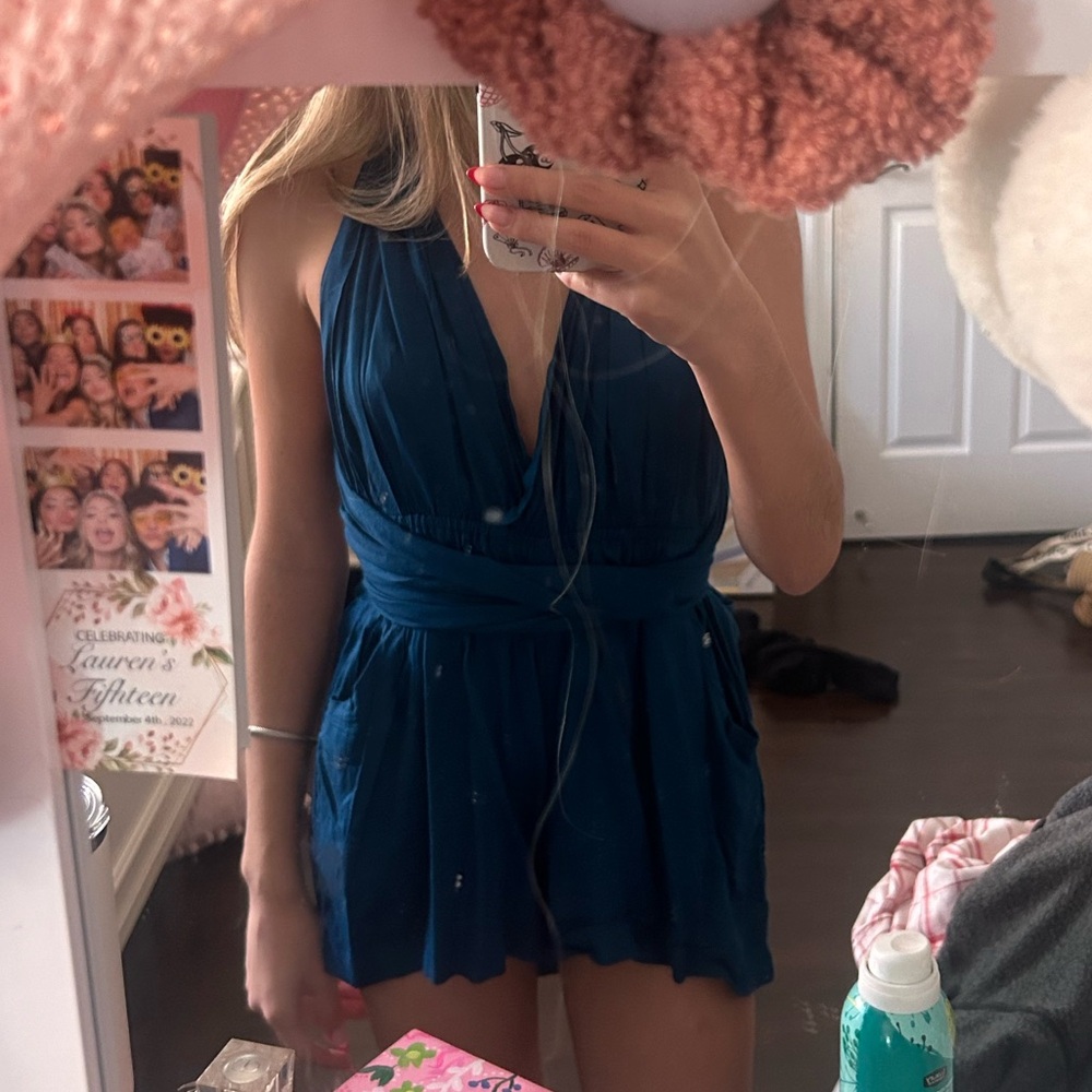 Blue/Teal open back romper from a boutique in Miami.